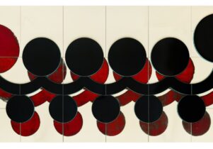 An abstract painting of red and black circles and curved lines.  