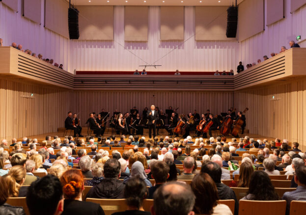 Manchester Camerata performing on stage in the Stoller Hall with audiences