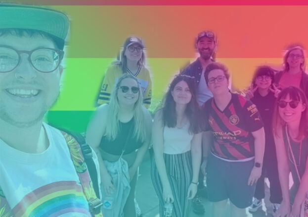 A rainbow hued photo of a group of people on a walking tour