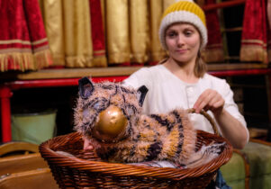 Actor with a tiger puppet A Tiger's Tale at Waterside Arts