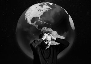 Factory International Autumn/ Winter Season at Aviva Studios : Artist Laurie Anderson holding her head in front of a giant globe