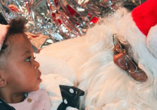 Cute baby with banta Clause