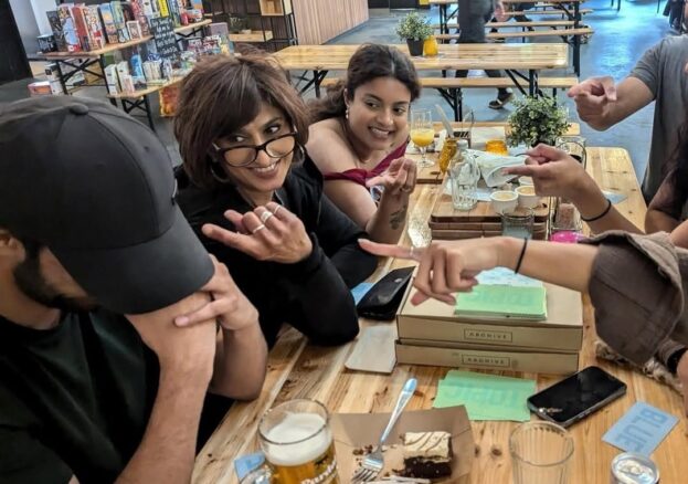 A group of people playing a boardgame